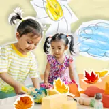 Two Girls Play At Kindergarten